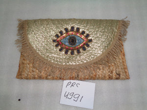 Eye embellished clutch